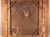 an old wooden frame with a painting of a man in a hat