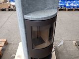 a stove that is sitting on a pallet in a warehouse