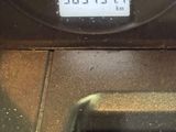 a close up of a car dashboard with a clock on it