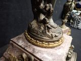 a statue of a man and a woman on a pedestal