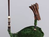 a green bag with a bird on it hanging from a string