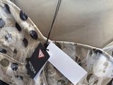 a close up of a dress with a label on it