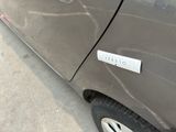 a close up of a car door with a sticker on it