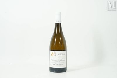 a bottle of wine that is sitting on a table