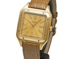 an image of a gold wrist watch with a brown leather strap