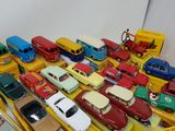 a lot of toy cars and trucks on a table