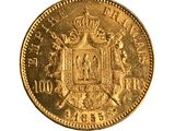 une image représentant une pièce d'or sur laquelle figurent des armoiries et une couronne