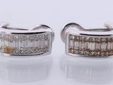 a pair of white gold and diamond earrings