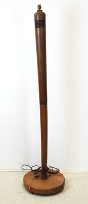 a lamp that is on top of a wooden stand