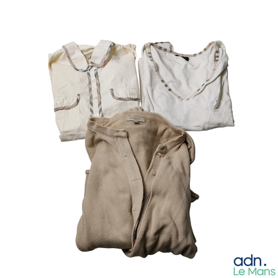 three pieces of clothing sitting on a white surface