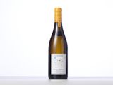 a bottle of white wine sitting on top of a table