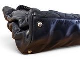black leather handbag on white background with clipping for text