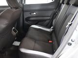 the back seats of a car are black and grey in color