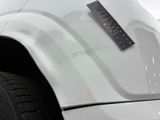 a sticker on the hood of a white truck