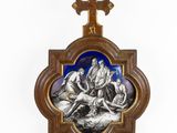 an old wooden cross with a picture of jesus and other people on it