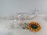 a glass bowl and a glass plate on a table