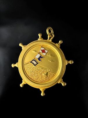 an image of a gold medal with a flag on it