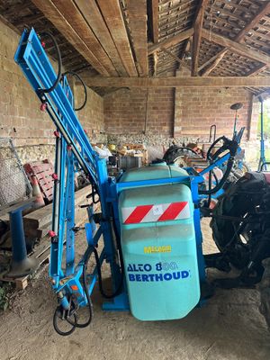 a tractor that is parked in a garage