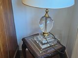 a lamp that is on a small table in a room