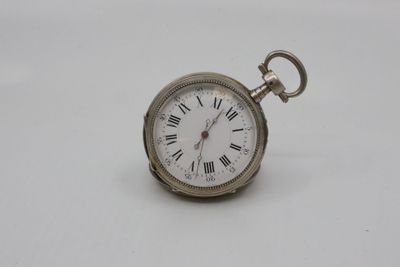 an antique pocket watch with roman numerals on a white background