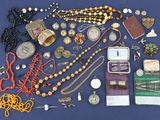 a lot of jewelry on a blue surface