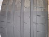 a close up of a tire on a shelf in a room