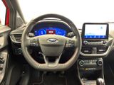 the interior of a car with a steering wheel, dashboard, and touch screen