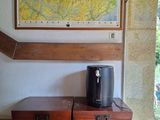 two wooden chests sitting on a tiled floor next to a map