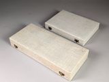 pair of wooden boxes with handles on a white surface