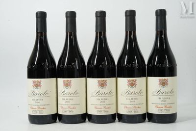 six bottles of red wine are lined up on a table