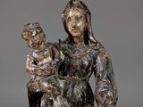 an image of a statue of a woman holding a child