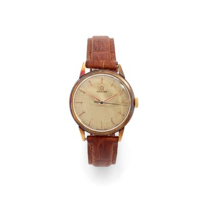 an old wrist watch with a brown leather strap on a white background