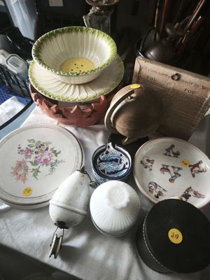 a table with a bunch of plates and bowls on it