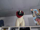 a stuffed animal that is on a shelf in a room