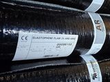 many rolls of black plastic that are stacked on top of each other