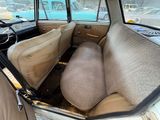 a view of the inside of a car from the driver ' s seat