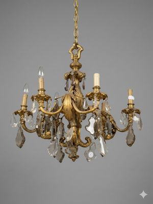 Important lustre en bronze à décor rocaille de feuillages, o…