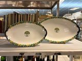 two plates that are sitting on a shelf in a store