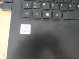 a close up of a laptop with a cable attached to it