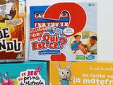 several children ' s books are stacked on top of each other on a table