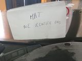 a sign on the hood of a car that says mat