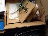 a cardboard box with wires and wires inside of it