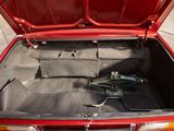 a trunk of a car with a pair of scissors in it