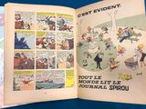 an open book with a picture of a cartoon on it
