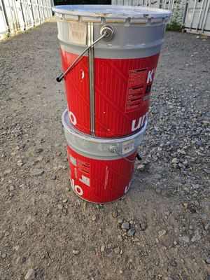 three buckets stacked on top of each other on the ground