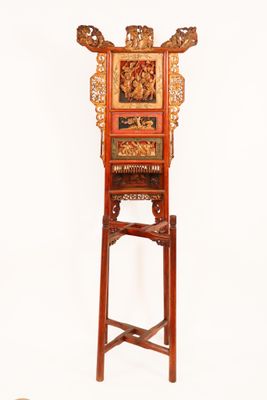 a tall wooden stand with a clock on top of it