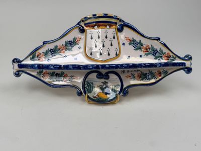 a blue and white plate with a clock on it