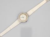 a lady ' s wrist watch with a diamond - set bezel