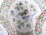 a plate with a picture of a woman riding a horse
