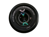 a close up of a camera lens with a bird on it
